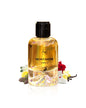 Flacon de parfum Montaigne Vanille Maison Alhambra 100 ML avec fleurs colorées en arrière-plan.
